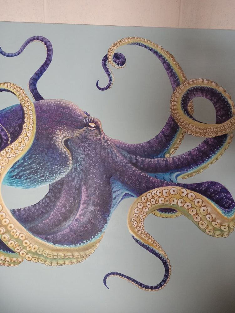 A purple and yellow octopus painting 