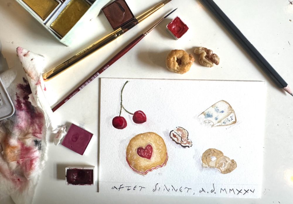 Watercolor tools, very unswept, with an in progress card of an ‘unswept floor’ mosaic- here with cookie, walnut, taralli etc
