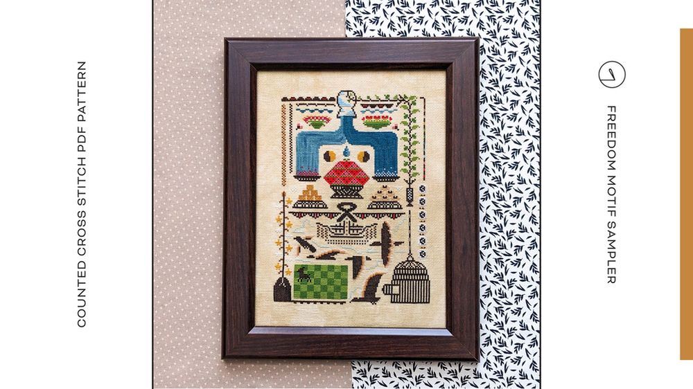 A cross stitch sampler with many symbols of liberation. The artist describes the piece as :  “Liberation. Independence. Freedom. A feeling with many different meanings and layers. This design bursts with vibrant symbols that embody some of the many ways this feeling shows up for me when I think of my ancestors and Juneteenth.”