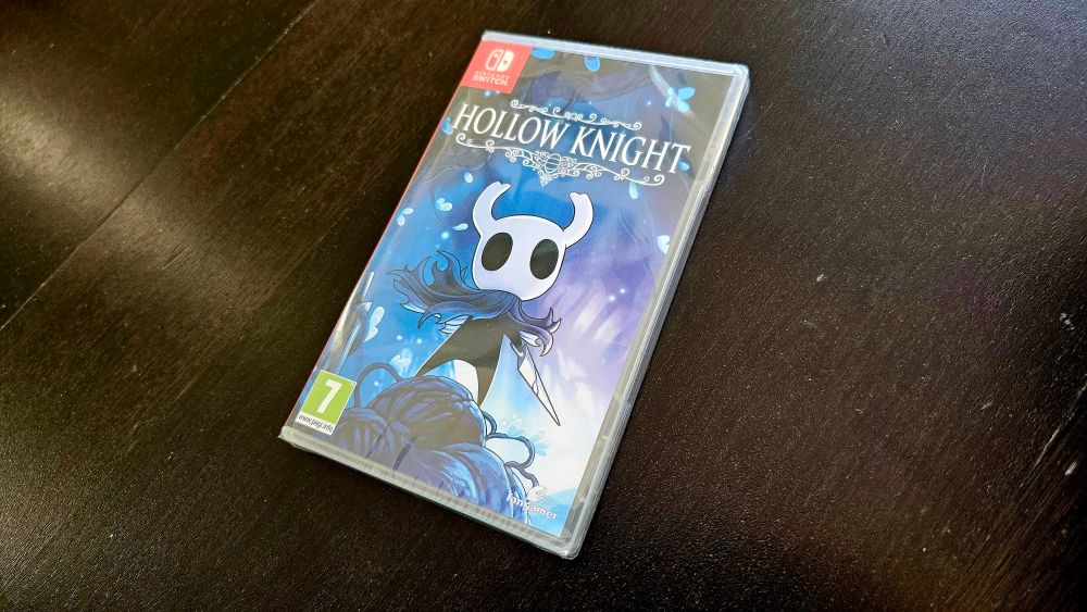 Hollow Knight by Team Cherry. Pegi Switch box, still sealed, lying down on the table. 
