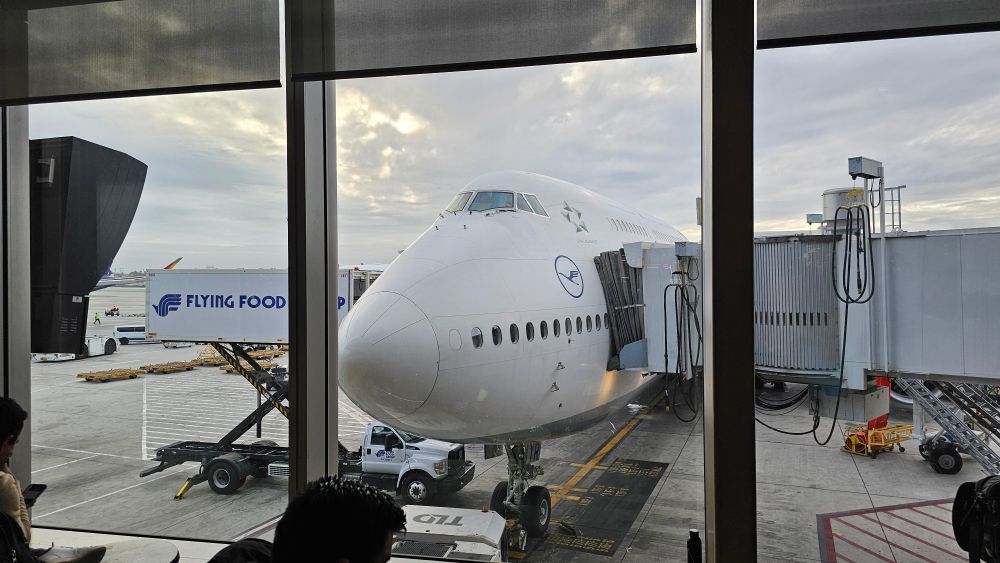 Plane through a window at the airport.