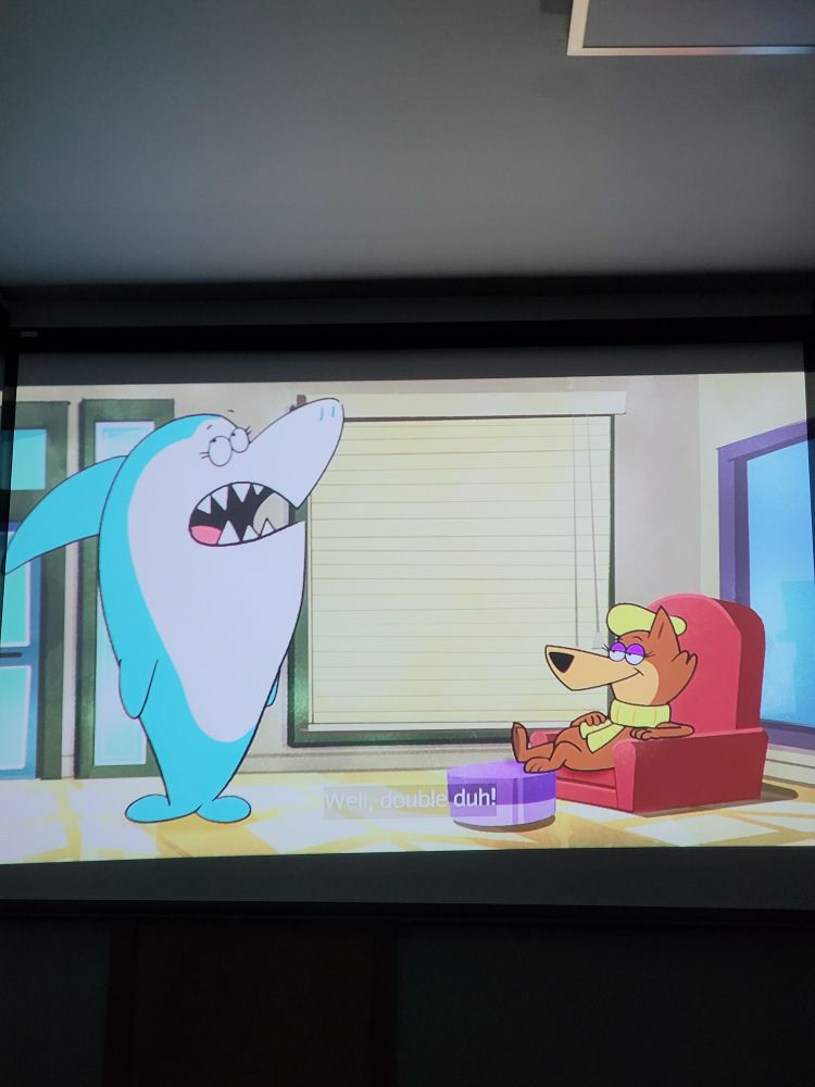 Loopy from Jellystone! Talking to Jabberjaw. Loopy is laying in a chair with her foot rested up on a chase. 

Loopy was male in her first appearance in 1959