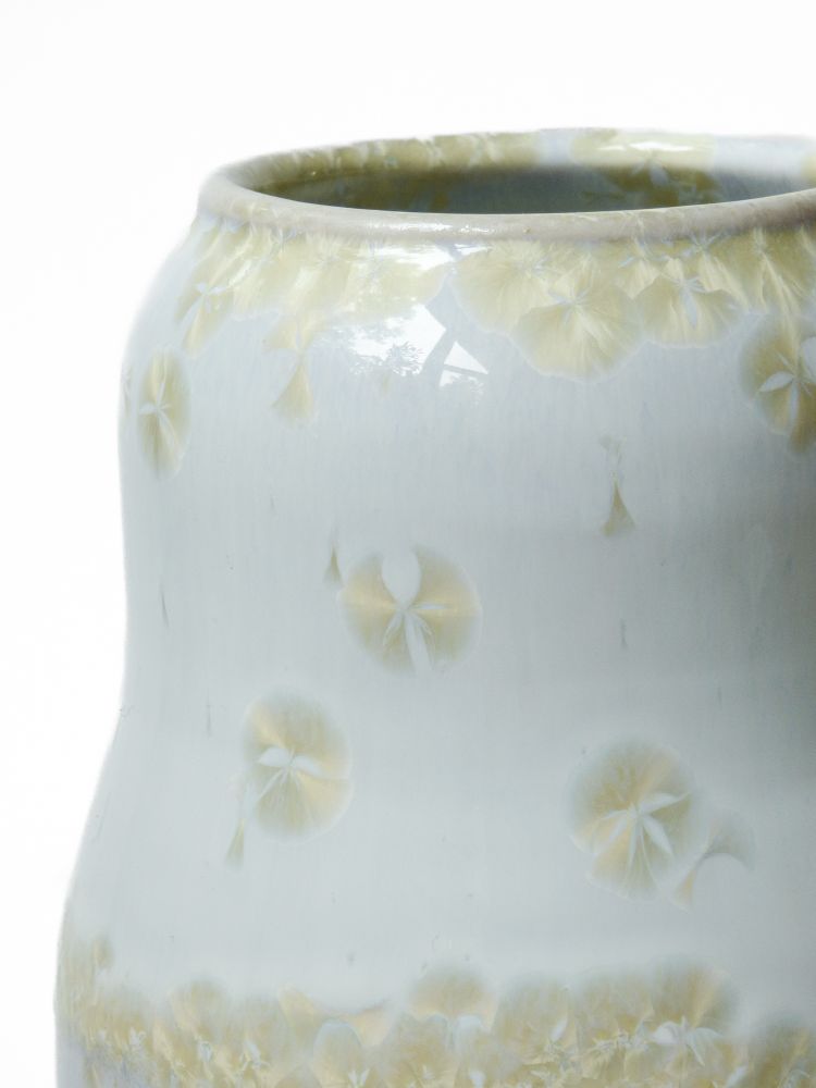 A white glaze with gold crystals 