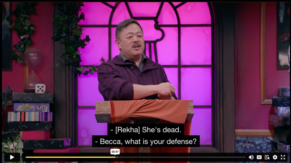 this image is of chris at the lectern, backlit by the "window". he's trying to go through the nomination and defense, asking becca to defend herself against amy's nomination.
here, though, there's a misattribution in the crosstalk. demi and rekha are having a short discussion because rekha keeps saying "i agree". demi says "why do you keep agreeing with everything?" and rekha says "i agree." they laugh.
then alexis, i believe, says "she's dead" this is attributed incorrectly to REKHA. saying "she's dead" makes no sense, since neither amy nor becca--the only other "she"s that could be referred to in this moment, are both still alive.
rekha, however, IS dead at this moment--which is why it's alexis (or amy, i guess) saying this to demi, not rekha. 