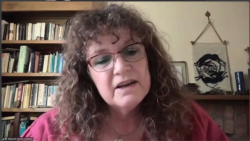 Zoom screenshot of headline poet Deborah Harvey during her poetry set at Crafty Crows July Edition 2025