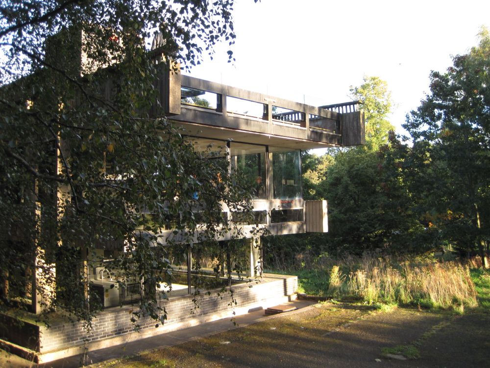 A concrete building, made up of a series of cantilevered terraces. 