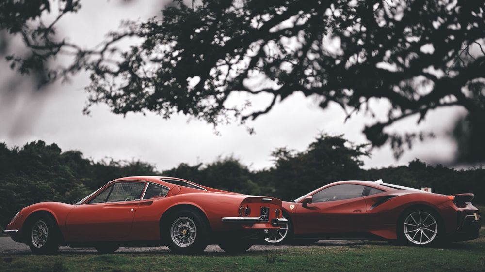 Taken by the driver of the Dino, this is the two cars parked up outside in a moorland area. The top half of the frame is Hawthorne bush silhouetted against the sky. The Dino gts is in the foreground with the Ferrari 458 Pista behind it.