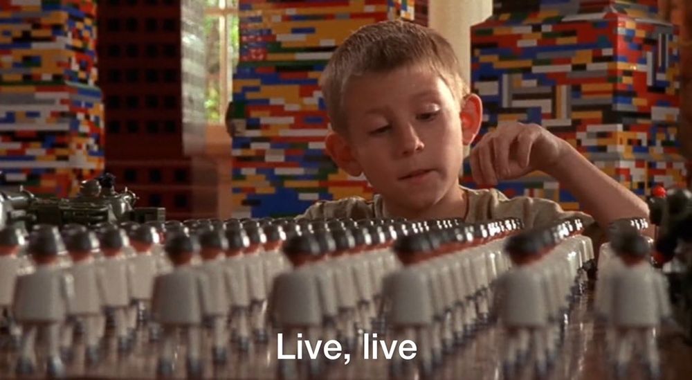 Dewey from Malcom in the Middle in front of dozens of playmobil guys saying "Live, live"