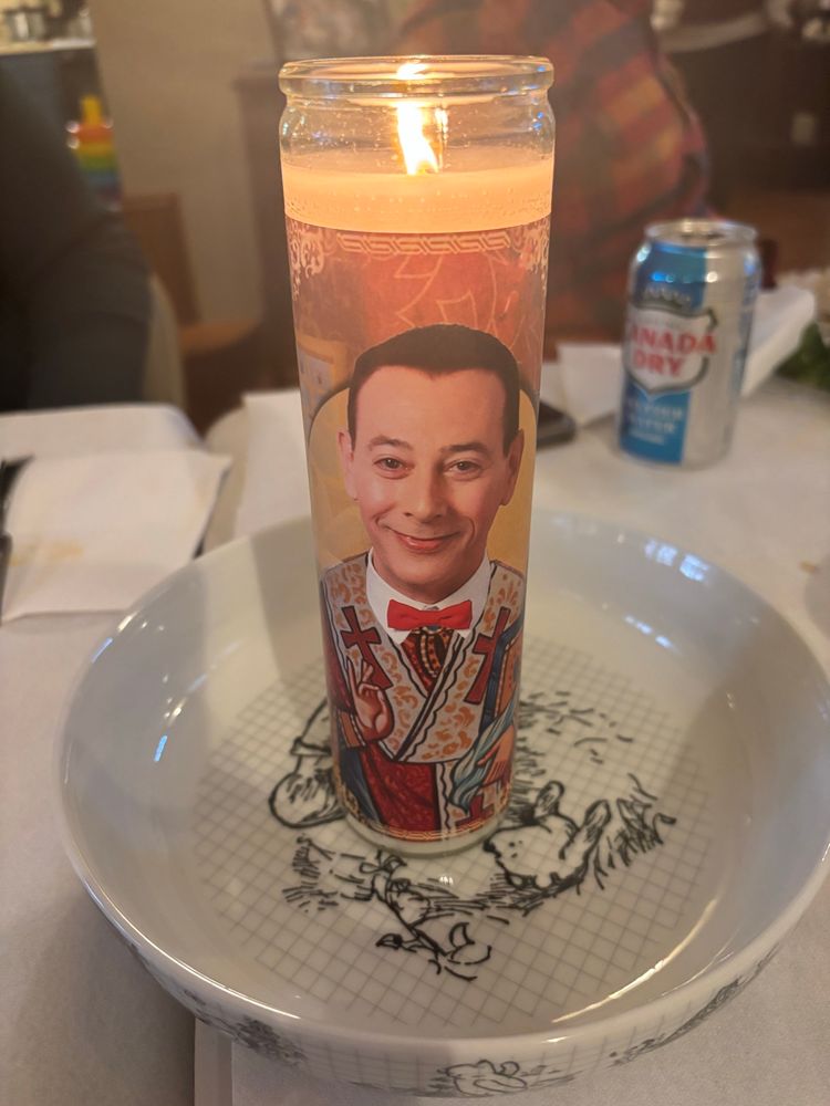 A lit PeeWee candle.