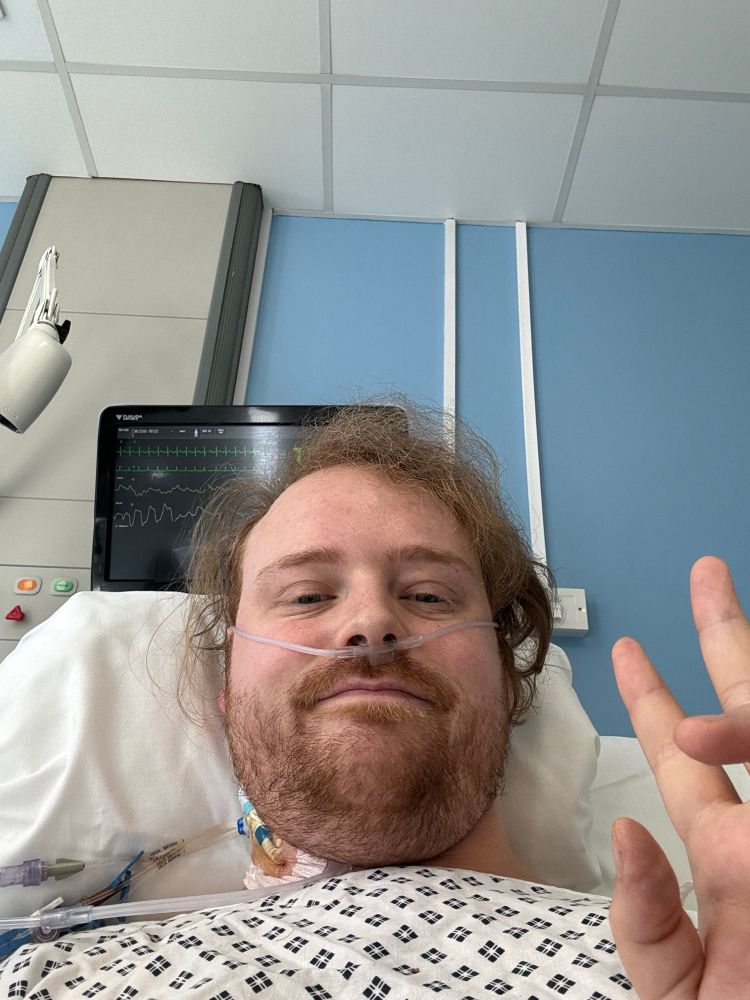 March 2025 hospital bed selfie with tubes all around 