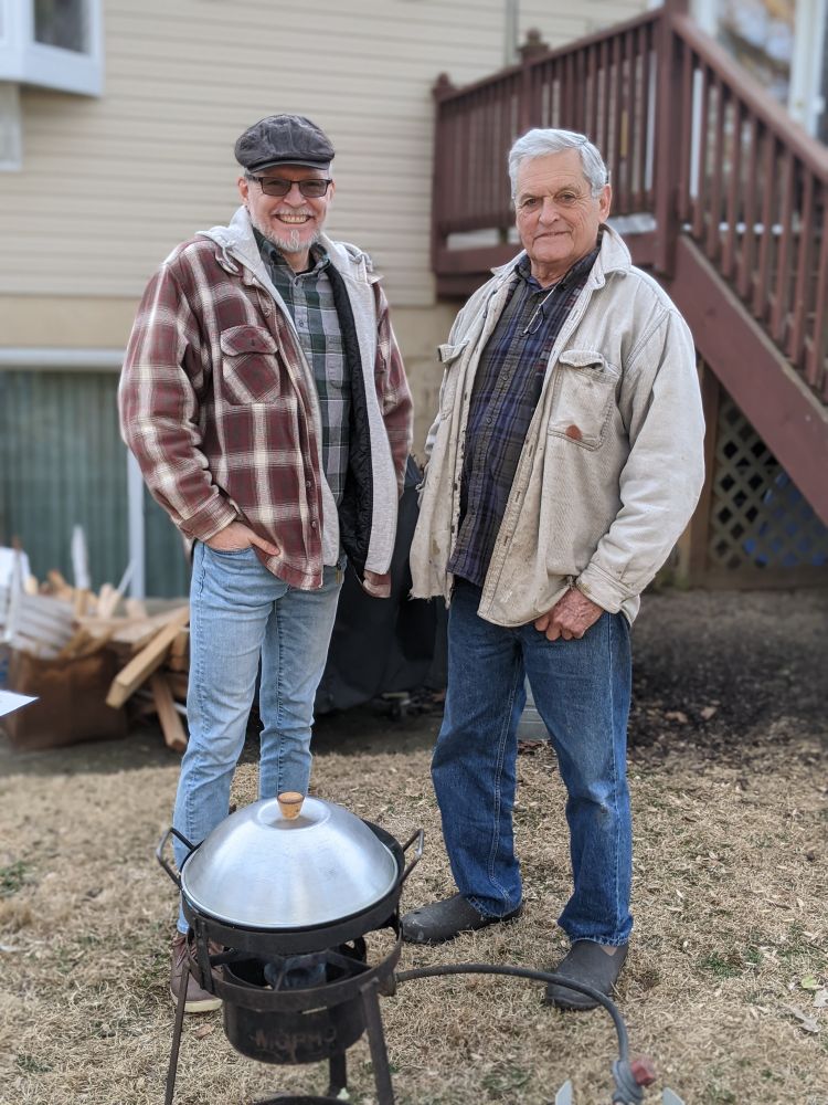 My uncle Ray and I cooking outdoors