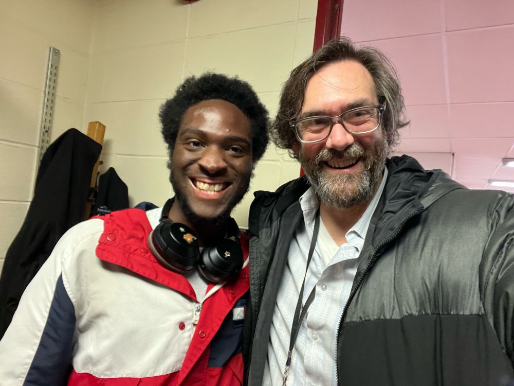Temple alum Rashad Reid (left) posing for a selfie with Chemistry Professor Vincent Voelz (right)