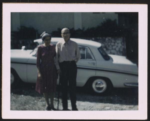 Rosa and Raymond Parks in front of a car which they did not own. 