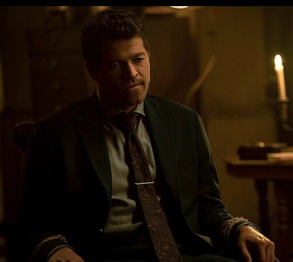 Misha Collins as Harvey Dent with wrists tied to chair 