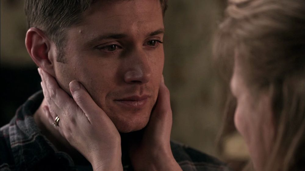 Mary Winchester holding Dean’s face 