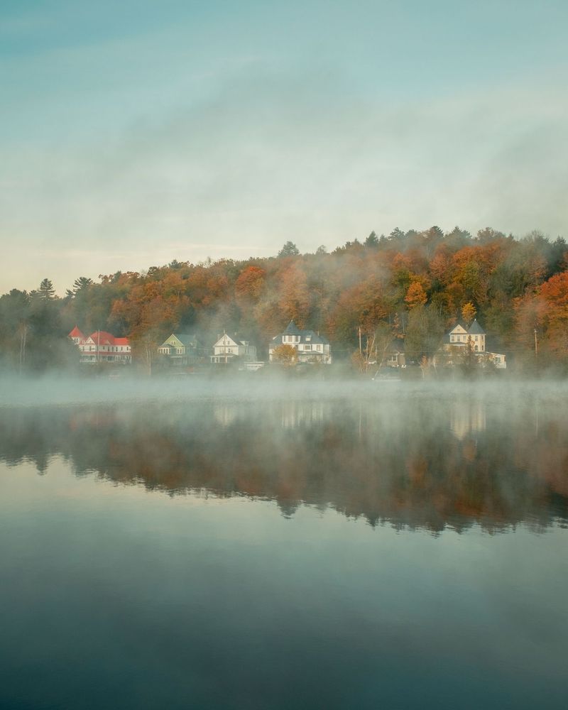 Morning fog and autumn color on Saranac Lake in the Adirondack Mountains, New York