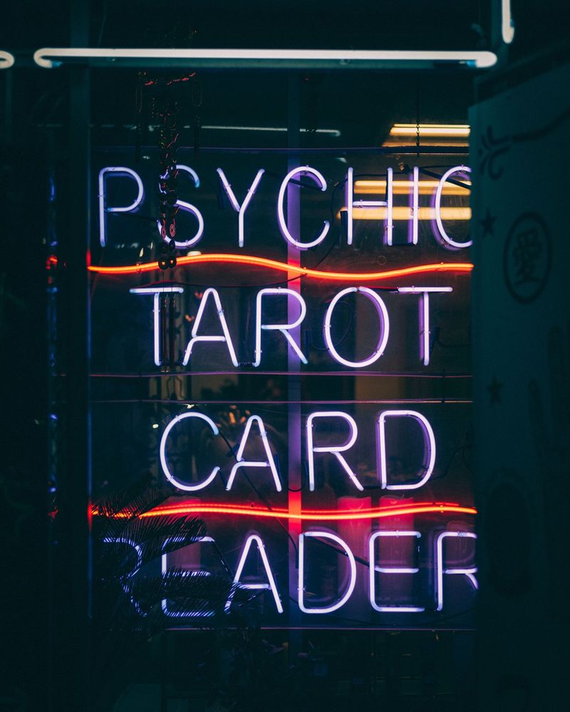 A neon sign reads 'Psychic Tarot Card Reader' in San Francisco, California.