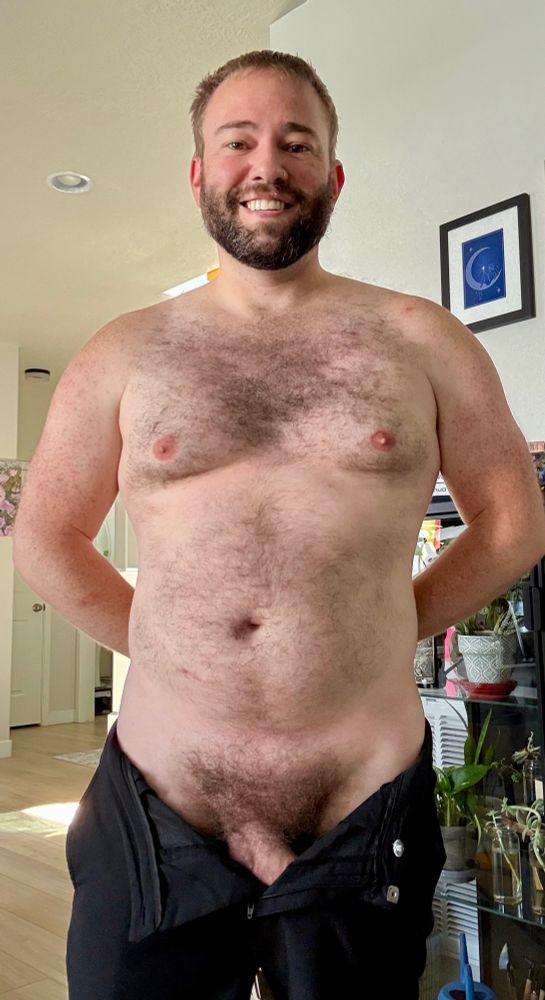 NSFW - hairy body. Pants are pulled down and open with full bush and just the top of dick shaft