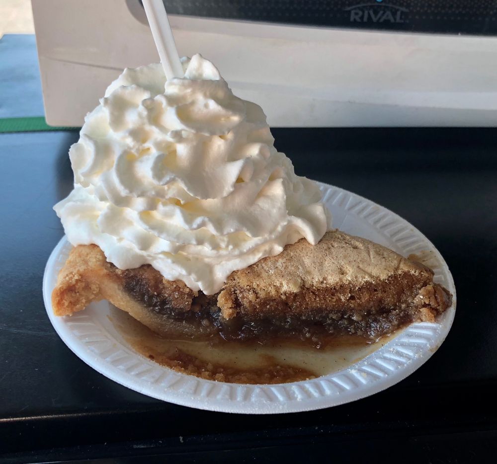 Shoofly pie with a big dollop of whipped cream on top. I went in for a free sample and i guess they got me because I ended up buying a slice against my better judgement (Dr’s orders 😒). Siri says: “Shoofly pie is a Pennsylvania Dutch dessert with a molasses-based filling and a crumbly, buttery topping. It is popular in Pennsylvania and beyond, especially among the Amish and Mennonite communities of Lancaster County.”