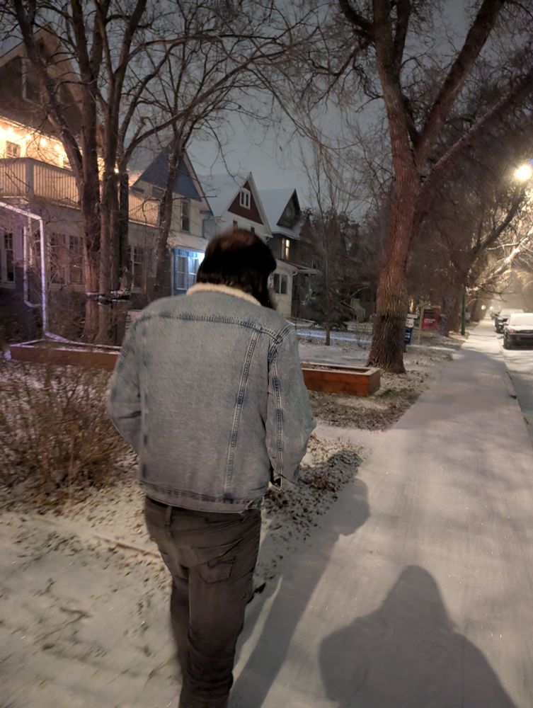 Snowing and walking down the street in silence with my husband 