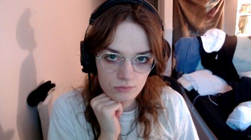 eden wearing new glasses looking into the camera