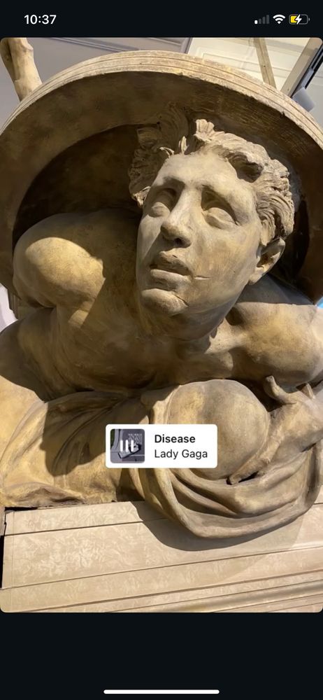 🧟‍♀️ Disease by Lady Gaga
Ancient statue close up of a man’s face as he’s being crushed under a shield