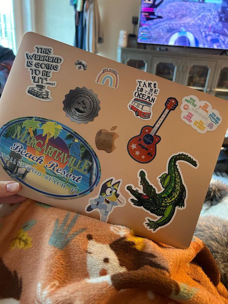Author S.E. Reed’s computer with stickers 
