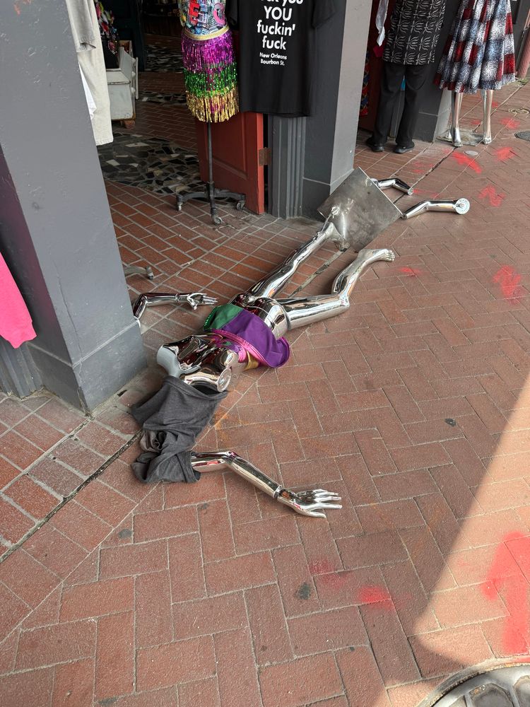 a broken mannequin on the ground