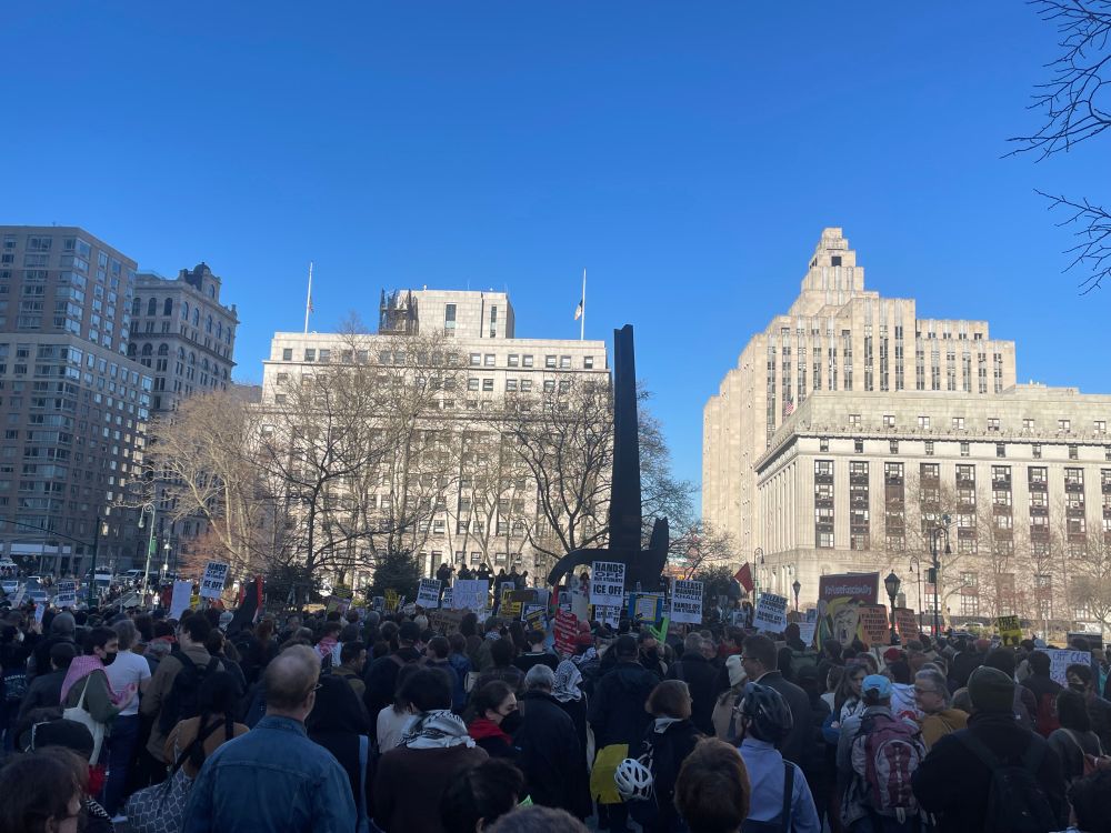 a photo of a few hundred protesters gathered in NYC
