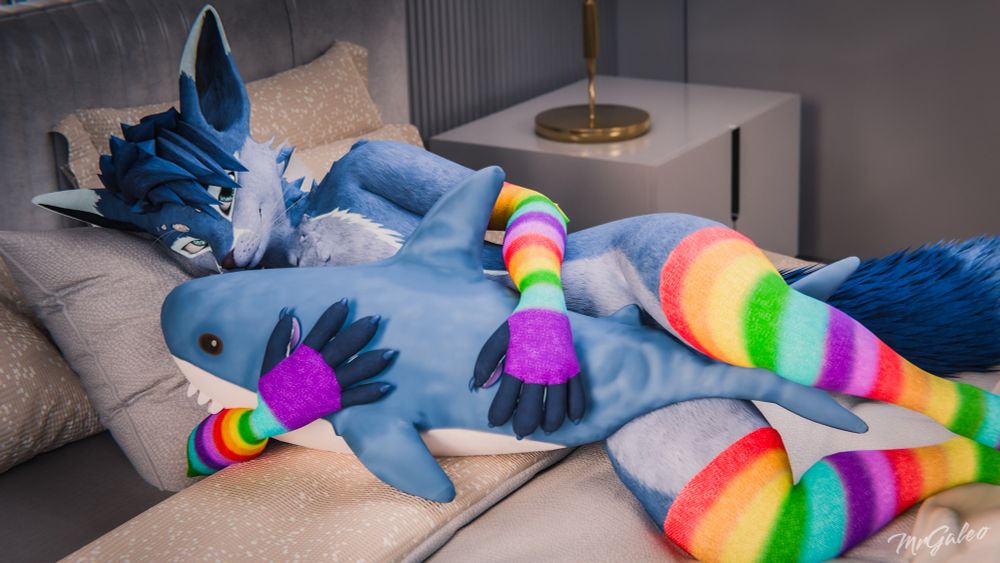 Digital rendering of a 3D scene featuring an anthropomorphic male blue fox character with dark blue hair and cyan eyes laying in a bed on their side inside a bedroom wile hugging a blåhaj (IKEA shark plush) and wearing rainbow-striped arm- and leg warmers
