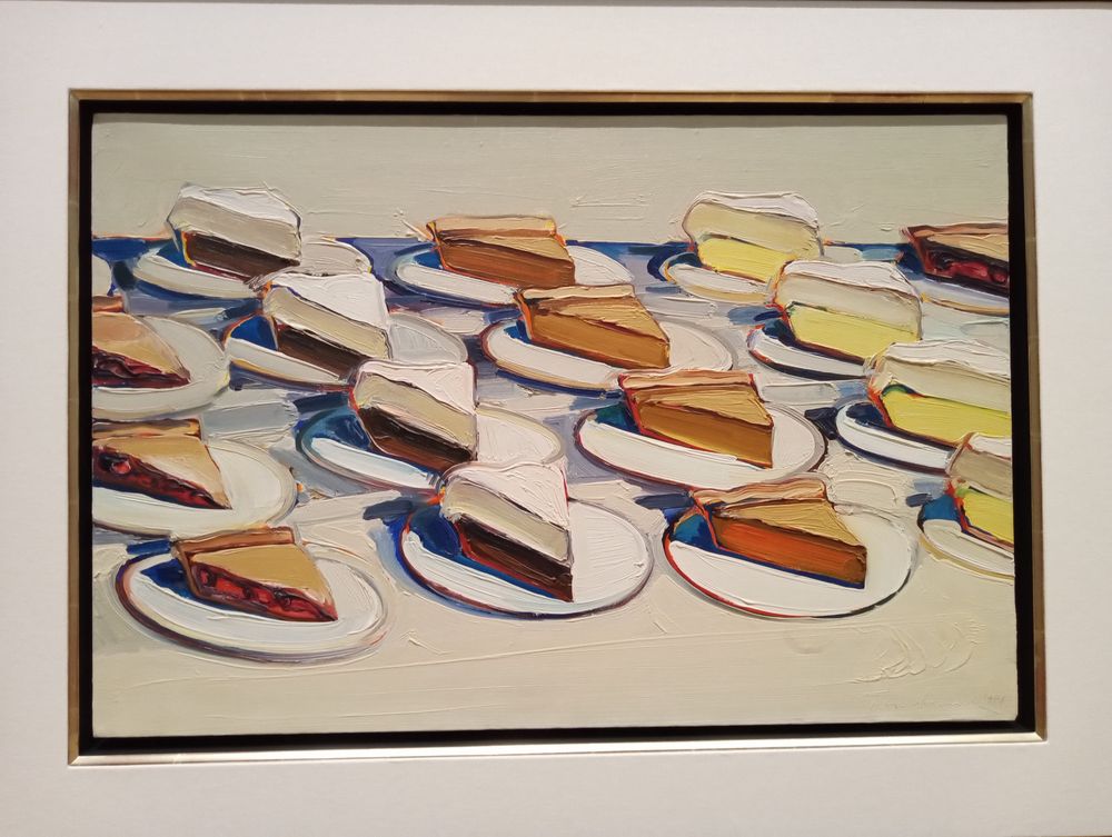 A painting of pie slices by Wayne Thiebaud.