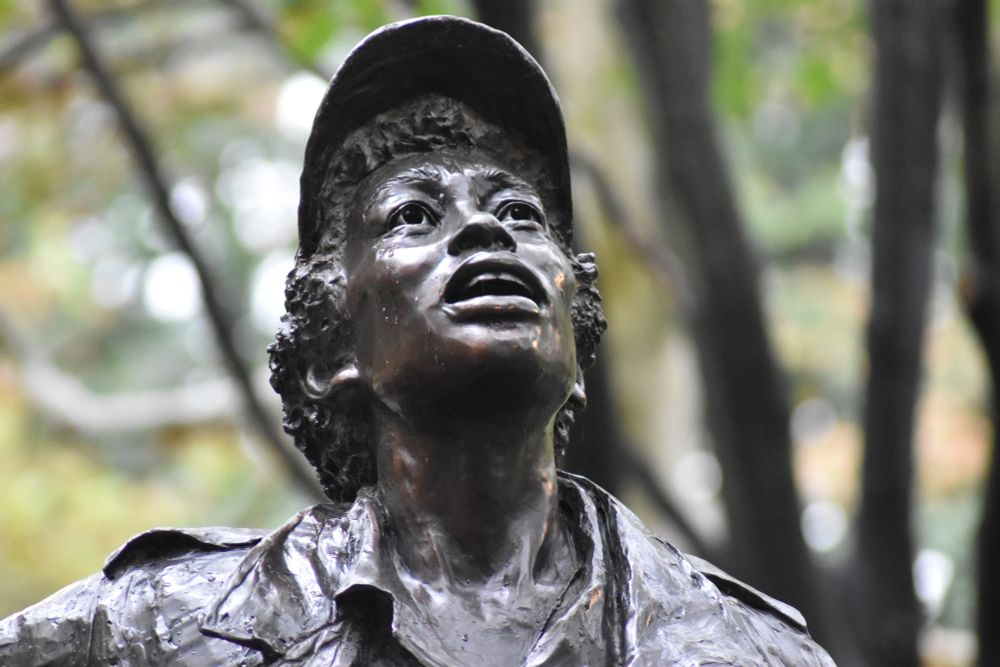 A woman looking up and calling out