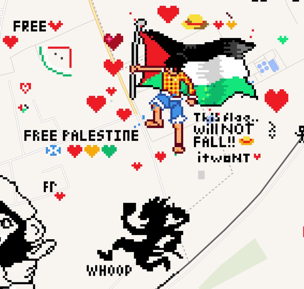 A closeup of the Gaza Strip on the WPlace website - featuring Monkey D. Luffy holding a Palestinian flag captioned with the words "This flag... will NOT FALL!!" as well as his Gear 5 silhouette.