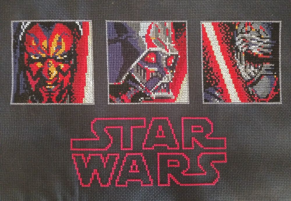 Darth Maul, Darth Vader & Kylo Ren 3 panel portraits done in cross stitch, with the Star Wars logo in red underneath.