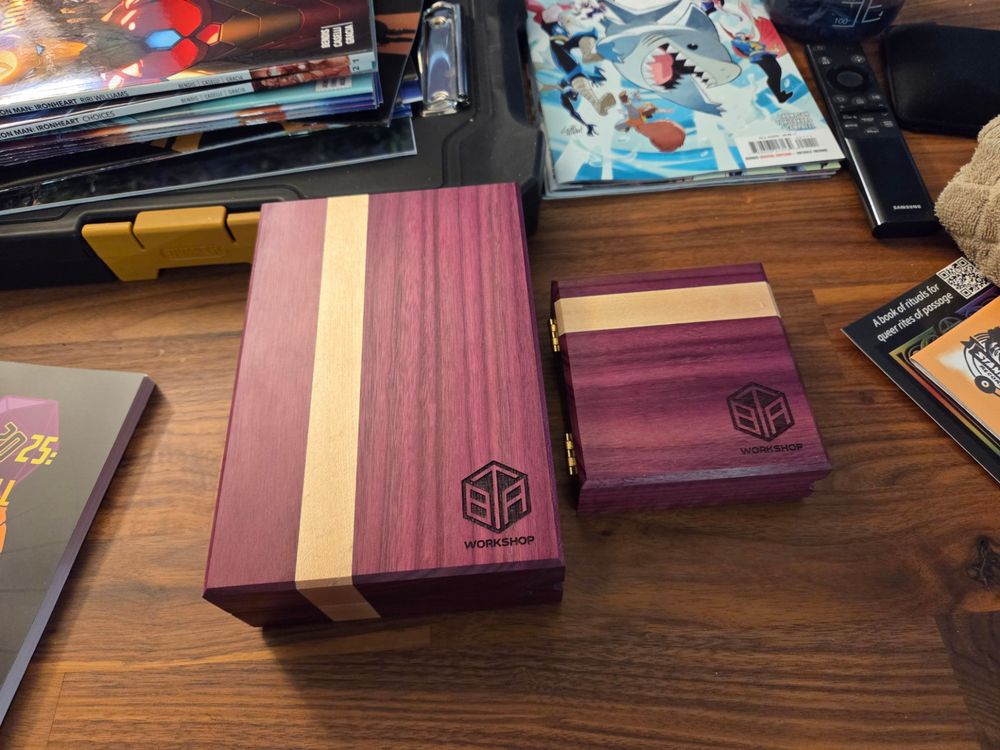Both dice boxes when closed. They're red with a tan stripe down the side.
