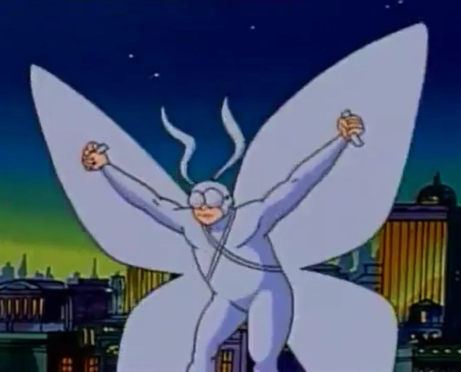 Arthur from 'The Tick' cartoon, in a moth suit, arms spread wide over his head, about to take off. It's night, and there is a city skyline behind him.