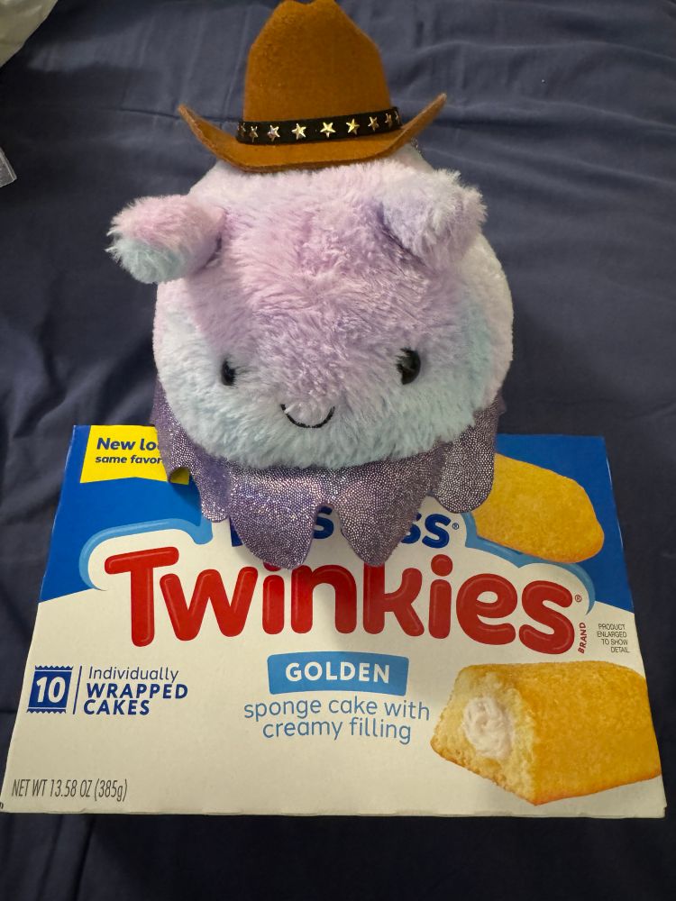 A sea slug sitting on a box of Twinkies