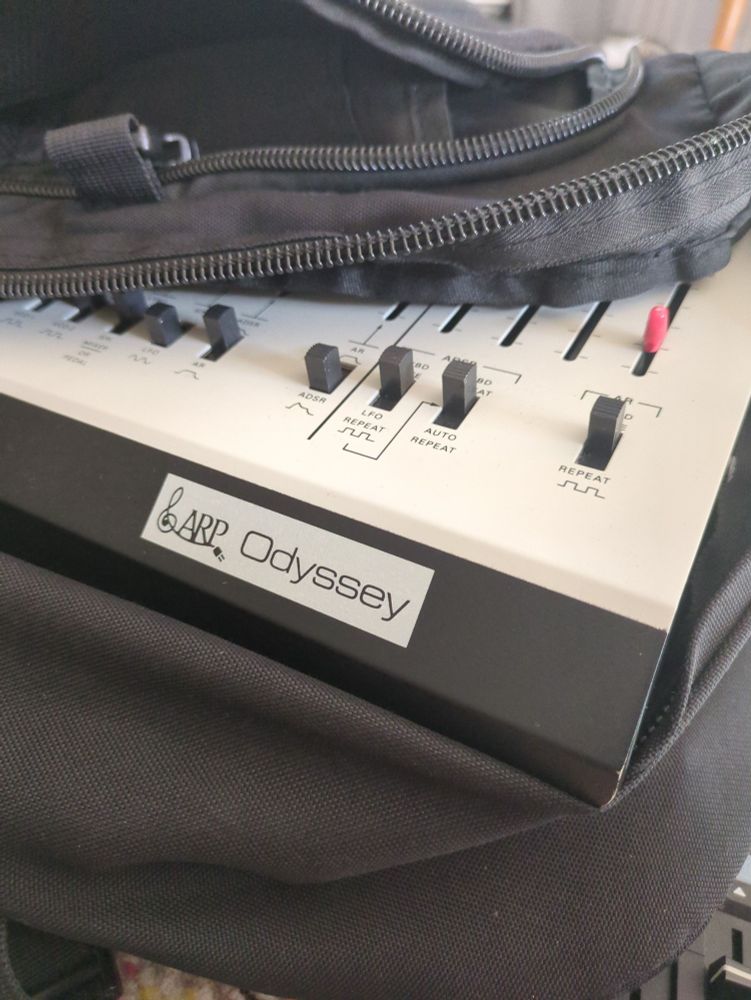 An Arp Odyssey, peeking out of a bag. 