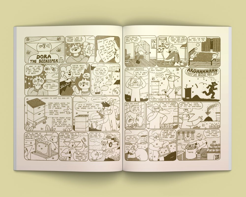 Mock-up photo of a two-page monochrome comic in a magazine. The comic is titled "Dora the beekeeper". In the comic a cat called Dora looks after her mouse friend's bee hives. 