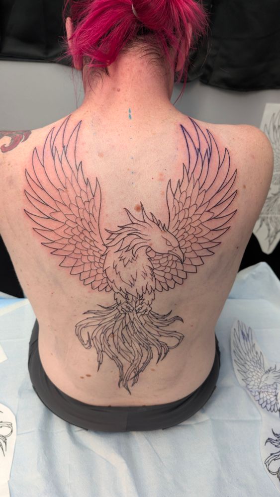 Selfie of a Phoenix tattoo on my back