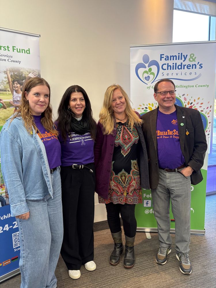 A photo of Mike posing with Kristen Cairney, ED of Wyndham House, Daria Allan-Ebron, ED of Family and Children's Services, and Kate Vsetula, Director of Community Programs with Guelph Community Health Centre.
