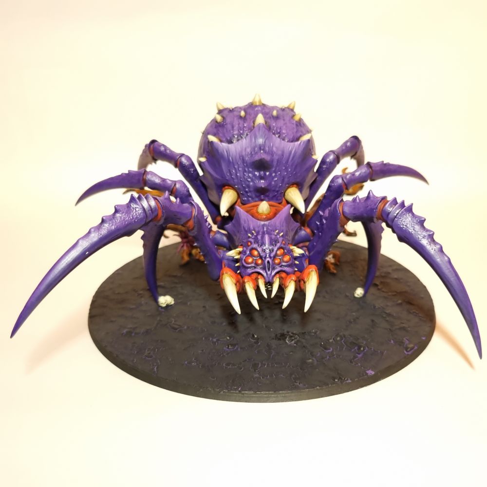 An AoS Arachnarok spider for the gloomspite gitz faction. It is painted purple and red
