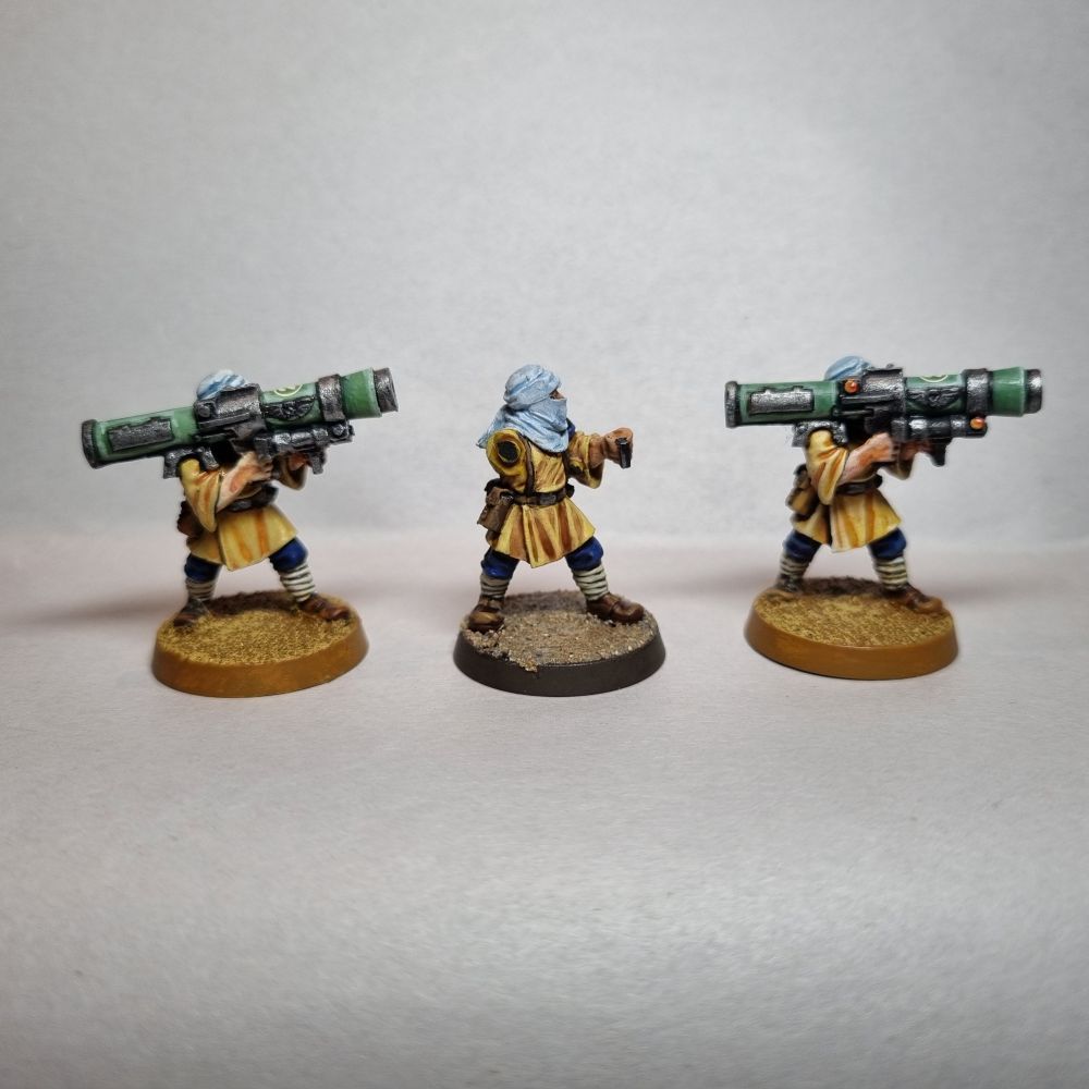 The front of 3 Tallarn desert raiders missile launcher troops. The center is my attempt at a replica.