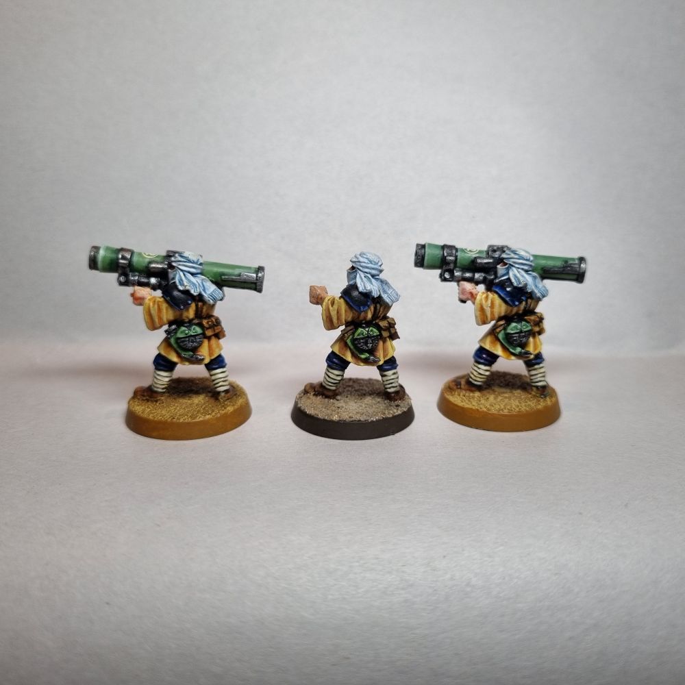 The back of 3 Tallarn desert raiders missile launcher troops. The center is my attempt at a replica.