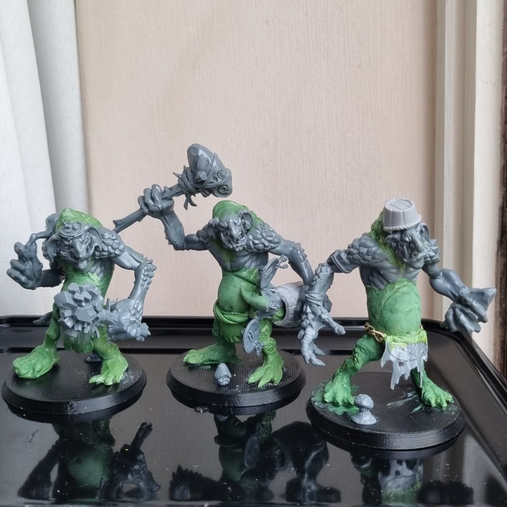 The three troggotha before paint. About 60% greenstuff.