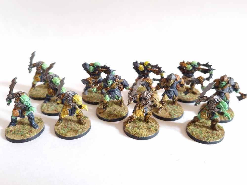 The various orca and goblins painted in a slap-chop style