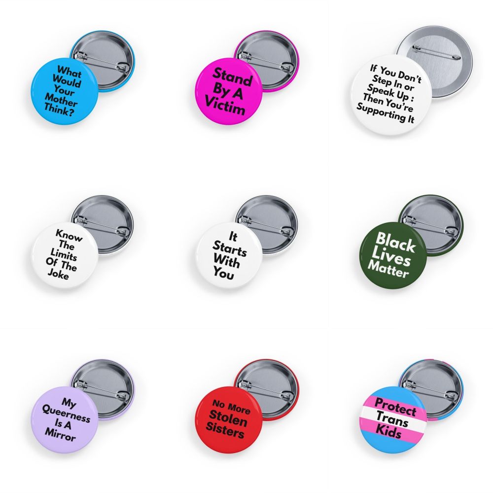 A collection of round pins featuring political slogans, pride flags in various colours, and humorous designs with bold, simple lettering. #Rob604 #Rob604designs LGBTQIA trans 