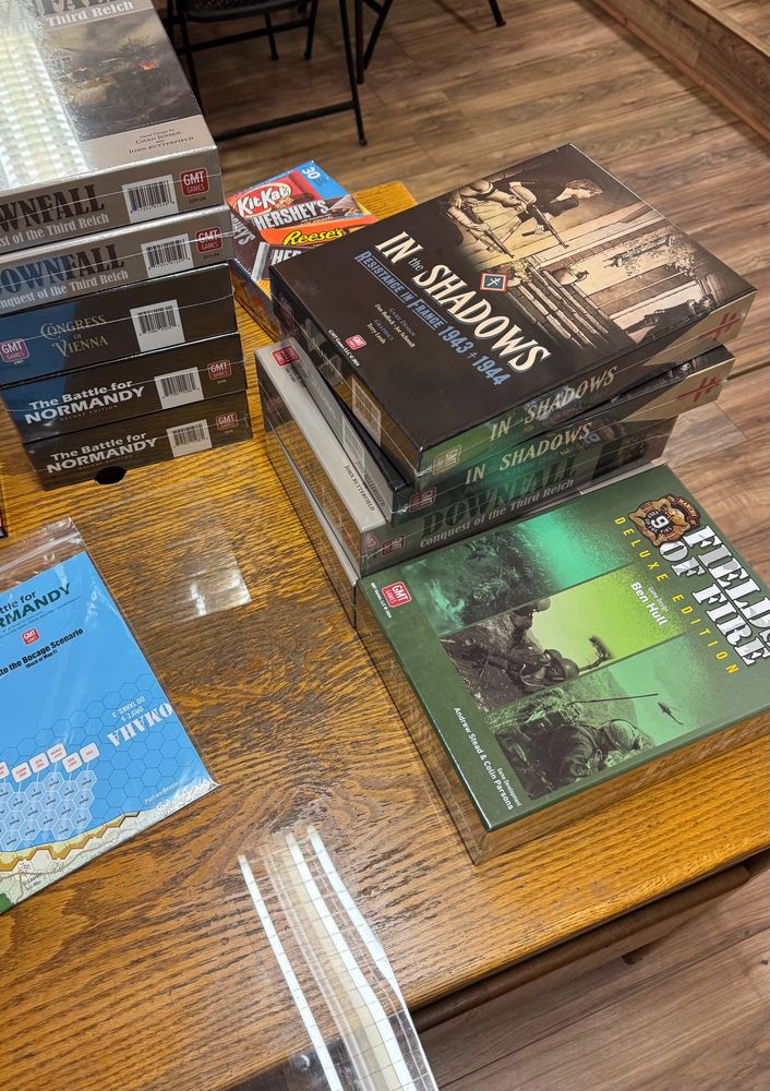 Pictured here: pre-production copies of Fields of Fire Deluxe Edition, In the Shadows, Downfall, Congress of Vienna, and The Battle for Normandy