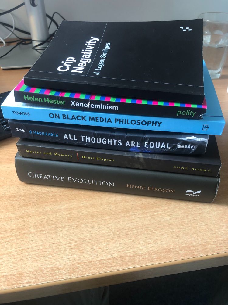 image of 6 books: crip negativity, xenofeminism, all thoughts are equal, matter and memory, creative evolution.