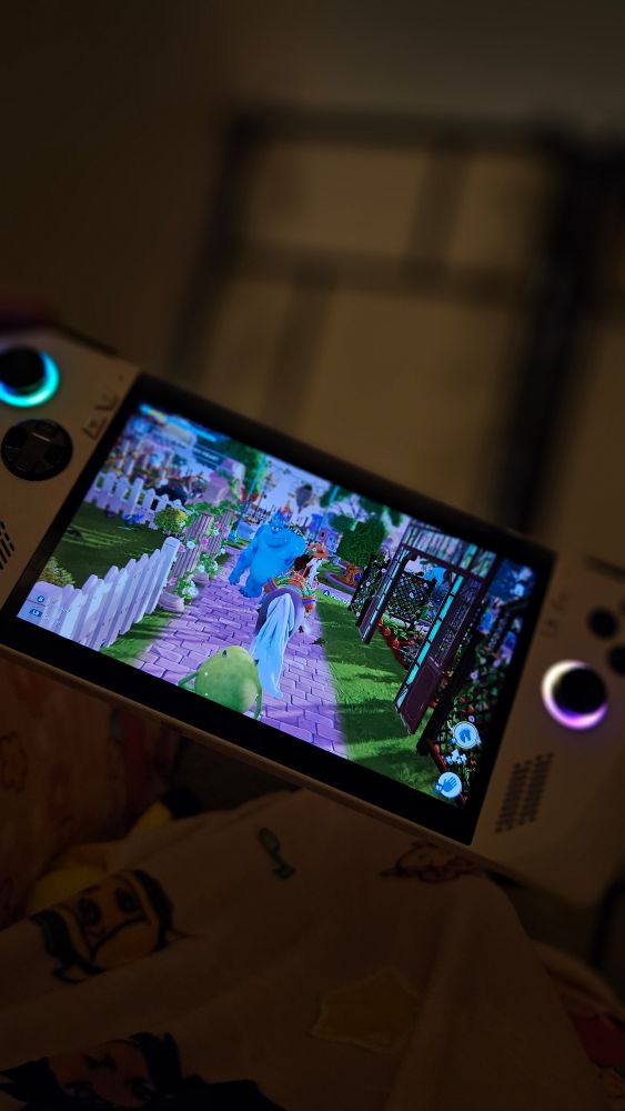 A console with a colorful game on against a dark background